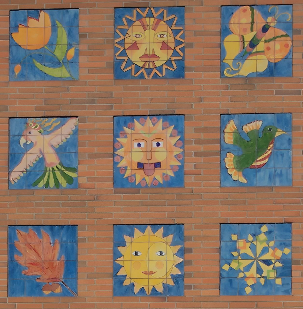 Colorful tiles with sun and nature motifs