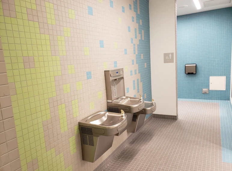 Drinking fountains in tiled hallway